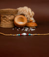 925 Silver Oval Bead Rakhi with Gold Thread - Rakhi Gift